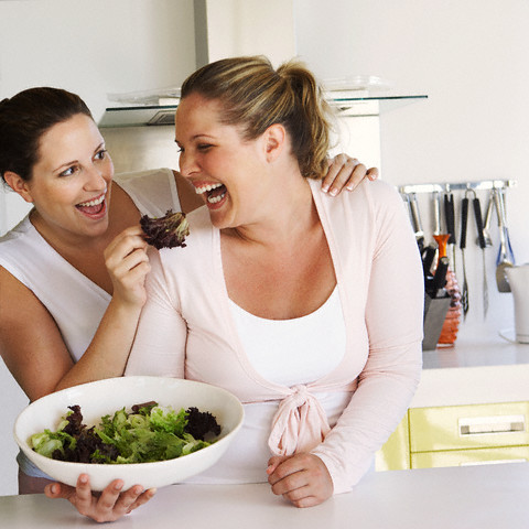Friends eating salad --- Image by © Heide Benser/Corbis